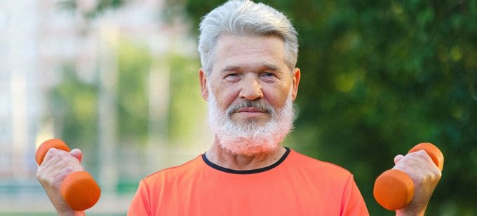 elderly man lifting weights, fitness trends